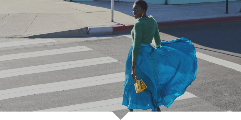 Woman walking on crosswalk